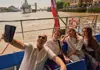 a group of tourists enjoying the Thames River cruise