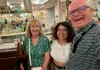 Food tour participants inside a historic Naples café with the guide behind the counter.