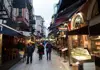 Evening view of a narrow Istanbul street lined with meyhanes and restaurant seating
