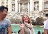 A tourist at the Trevi Fountain in Rome.
