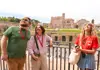 A pair of tourists looking at the Temple of Venus and Rome with their guide from The Tour Guy.