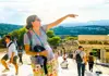 guide pointing on top of acropolis