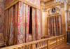A tour group inside the King's State Room looking at the artwork on the celling and wall.
