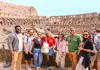 A group of tourists standing on the 2nd level of the Colosseum with their guide from The Tour Guy.