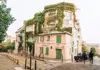 Ivy-covered building along a picturesque street in Montmartre in Paris