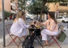 Two girls sitting and drinking wine in Rome