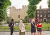 An image of a Tower of London Beefeater speaking with a group of tourists on tour with The Tour Guy.