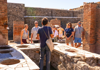 Tour guide describing kitchens in Pompeii