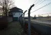 Barbed wire fence and guard structures at Sachsenhausen Concentration Camp site