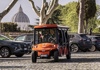 Golf Cart riding across the streets of Rome