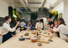 People preparing pasta in a school