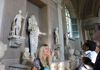 A group of tourists inside the Vatican Museums.