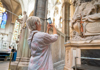 A group of tourists inside Westminster Abbey with a guide from The Tour Guy.