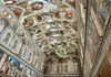 A group of tourists walking through the Hall of Maps inside the Vatican Museums while on tour with The Tour Guy.