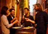 A group of tourists eating pasta in a restaurant in Rome.