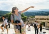 guide pointing on top of acropolis
