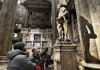 people looking at st. bartholomew statue at milan duomo