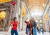 A picture of two tourists inside of St. Peter's Basilica in Italy while on tour with The Tour Guy. 