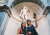 A woman in front of the Statue of David in the Accademia Gallery with her guide from The Tour Guy.