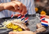 woman eating fish