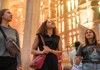 Three women inside the Sagrada Familia.