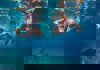 Swimmers in goggles underwater photo