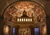 A golden mosaic decorates the curved apse of a historic church, illuminated by warm lighting.