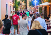 A group of tourists walking through Trastevere at night while on tour with The Tour Guy.