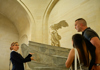 Tourists inside the Louvre Museum with their guide from The Tour Guy.