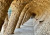 A picture of the empty Colonnaded Pathway inside of Park Guell in Barcelona. 