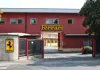 Entrance gate of the Ferrari factory in Maranello with Ferrari logo signage