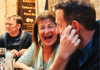 Women laughing during a food tour in Paris