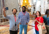 A photo of tourists taking a selfie inside of St. Peter's Basilica while on tour with The Tour Guy. 